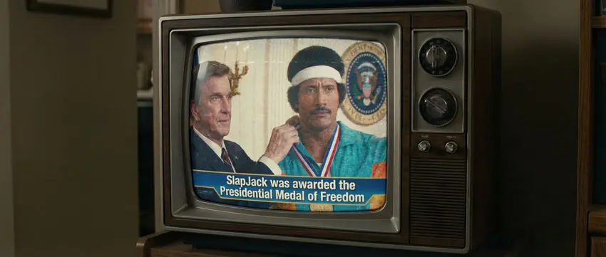 Deepfake de Leslie Nielsen condecorando al deepfake de Dwayne "The Rock" Johnson en el trailer de "Stone Hand"