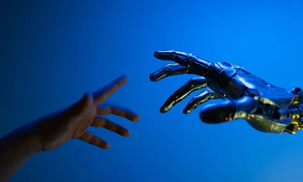 Mano humana tratando de alcanzar mano robótica